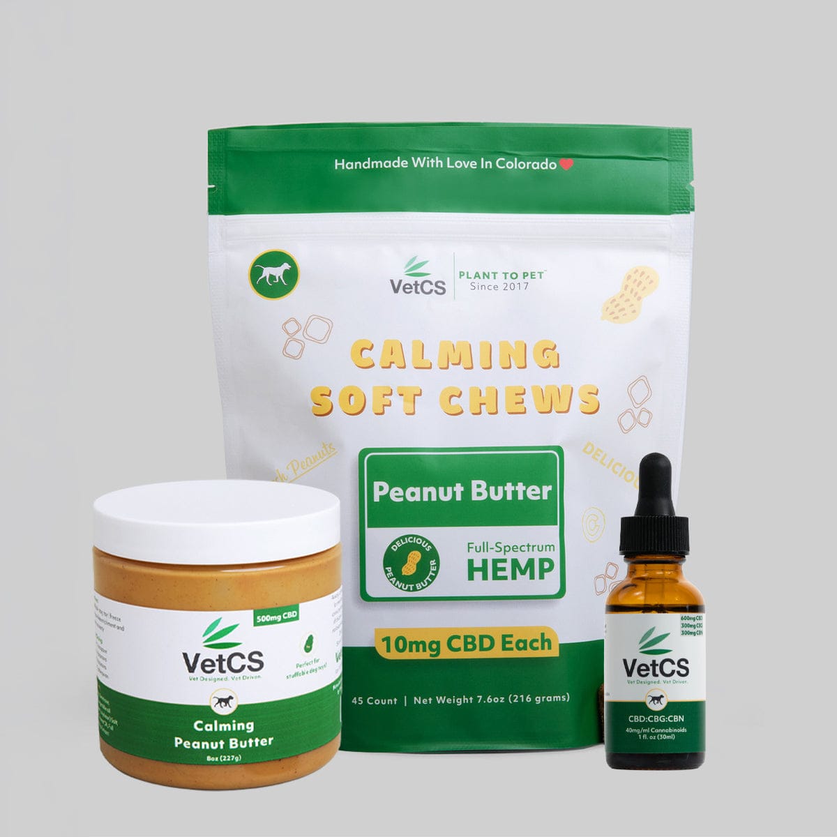 VetCS CBD products including soft chews, peanut butter, and a bottle on a gray background