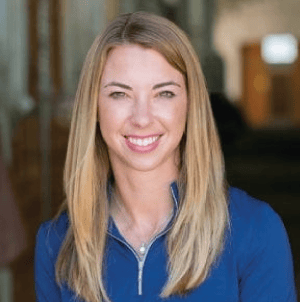 Chelsea Luedke standing in a horse barn