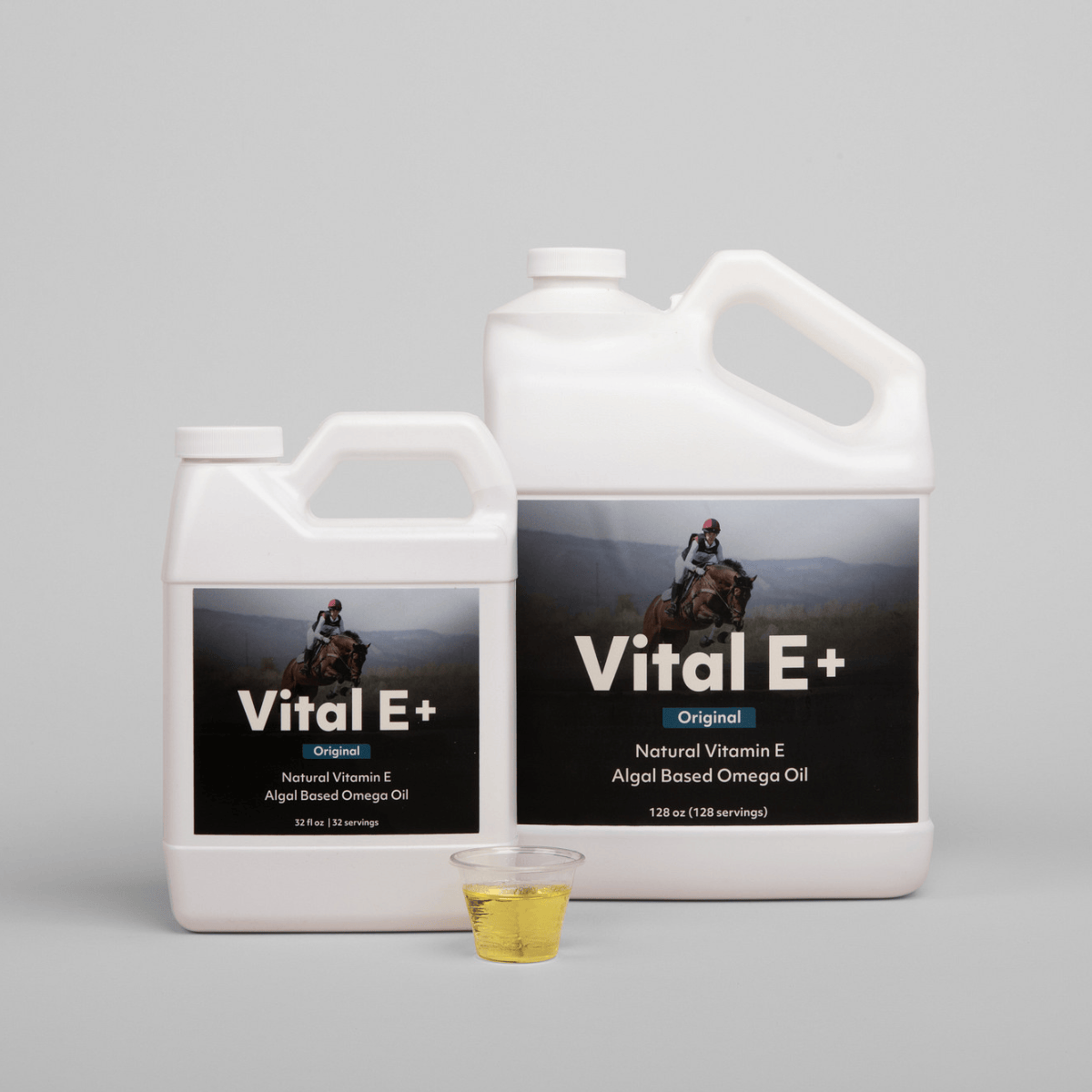 VetCS Vital E+ Oil  in a smaller and bigger size with a light gray background 
