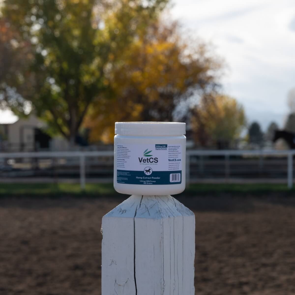 VetCS horse hemp extract powder balancing on fence at a farm