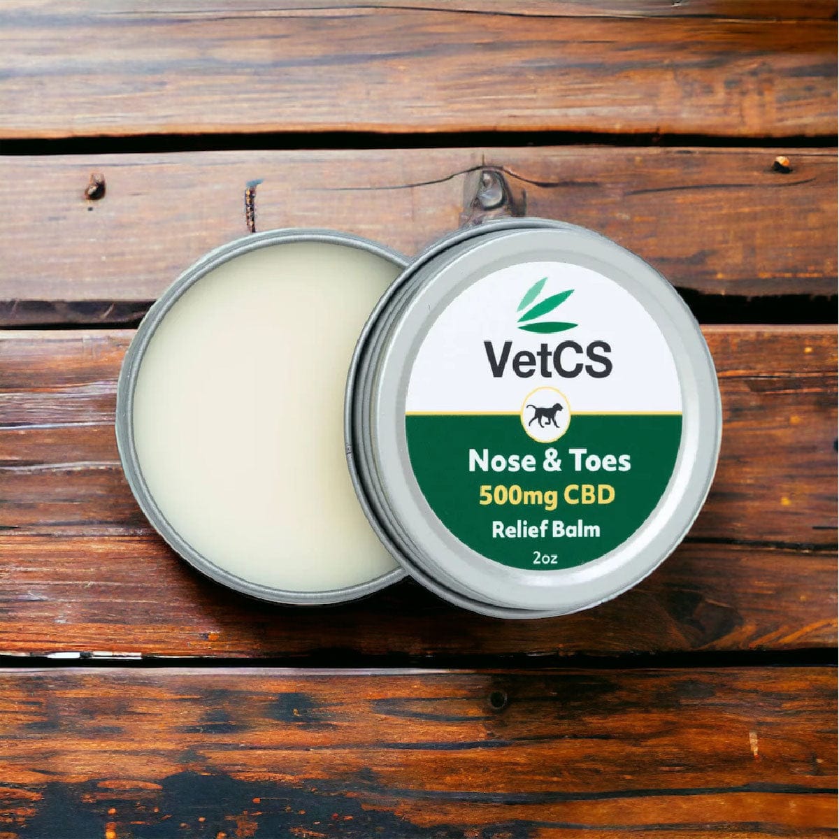 VetCS 2oz CBD Nose and Toes Palm for Dogs open on wood table