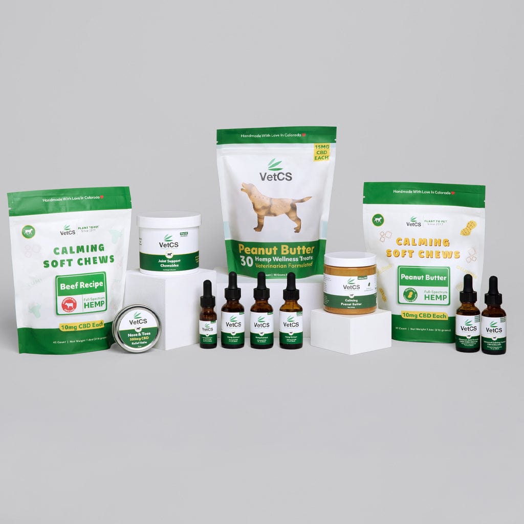 Full lineup of VetCS CBD for dogs including oils, chews, peanut butter, and topical products displayed on a neutral background.