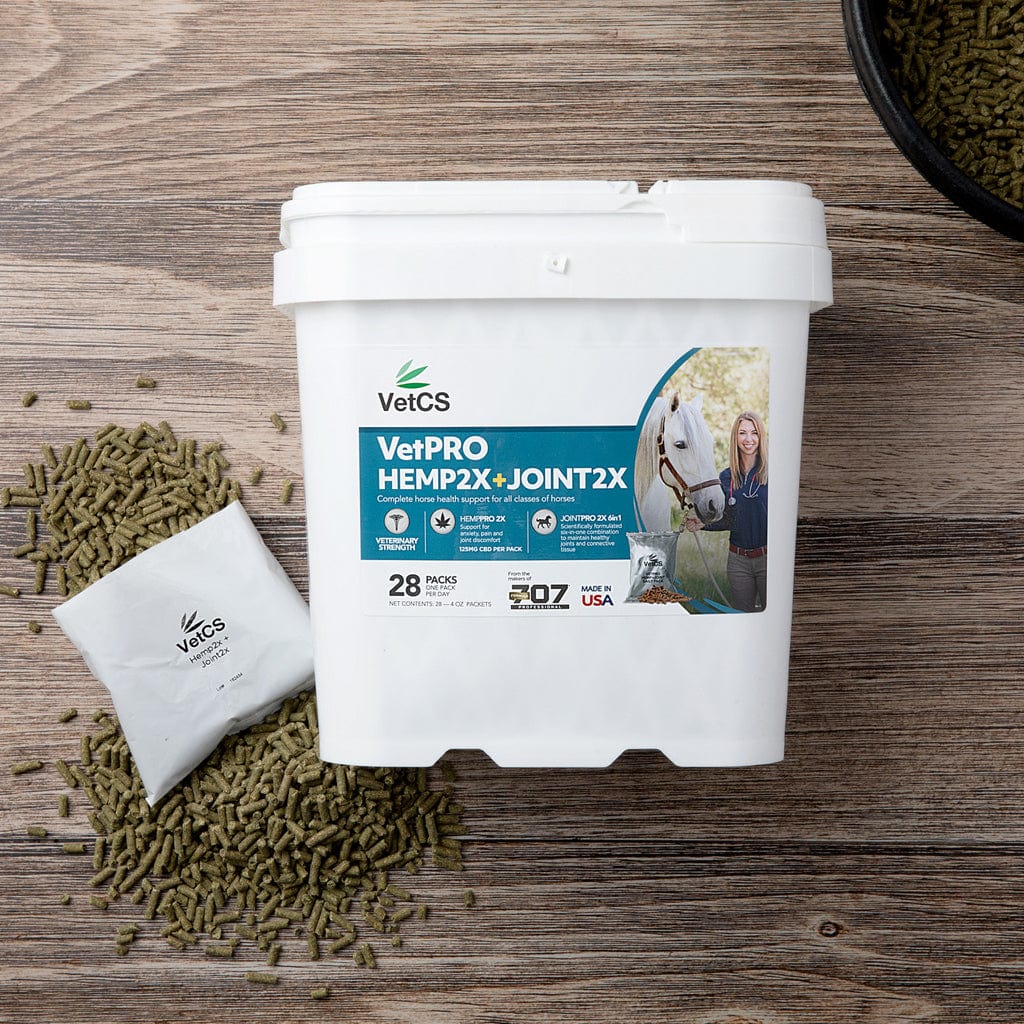 VetCS VetPRO Hemp2X + Joint2X horse supplement container with daily pellets on wood background